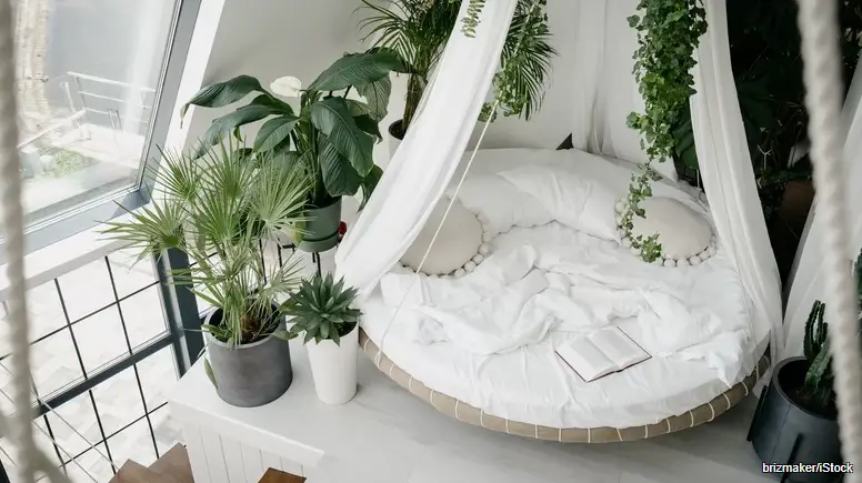 how to make your bedroom feel tropical for summer